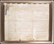 A framed and glazed early 18th century Georgian ( George III ) indenture dated to 1734, retaining