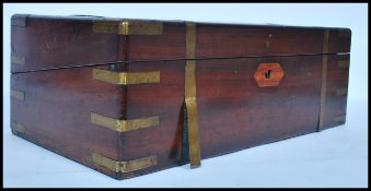 A good sized 19th century mahogany and brass bounjd writing slope opening to reveal a fully