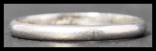 A vintage 20th century platinum band ring of plain form. Weighs 2.8 grams size N.