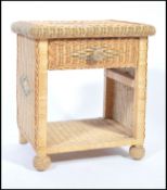 A vintage 20th century whicker occasional / side table of square form, open front with a single