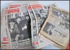 A collection of approximately 50 - 60 vintage Melody Maker music magazines / papers dating from