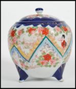 A vintage early 20th century Japanese ceramic lidded biscuit barrel having painted floral decoration