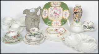 A collection of ceramics dating from the 19th century to include a Minton Silenus jug, relief-