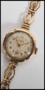 A 20th century ladies 9ct gold cased bracelet watch by Zentra, having quartz movement set to a 9ct