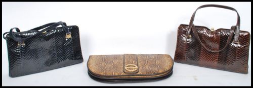 A collection of three ladies snakeskin handbags clutch bags to include examples by Ackery of