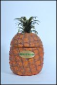 A retro Britvic pineapple shaped ice bucket having the original liner to centre. Measure: 28cms