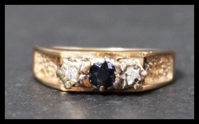 A vintage hallmarked 9ct gold sapphire and diamond three stone ring. Hallmarked for Birmingham