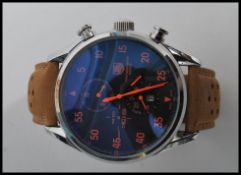 A Tag Heuer First Swiss Watch In Space 50th anniversary Spacex watch having a large black dial