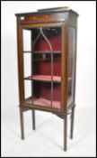 An early 20th century Edwardian inlaid mahogany display cabinet, fitted with a pair of glazed