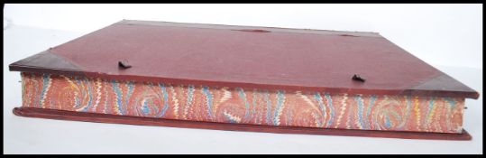 A 19th century leather spined book form print box of large form having notation panel in morocco