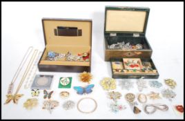 A good collection of costume jewellery contained within two jewellery boxes to include silver items,