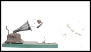 A vintage style cast iron point of sale advertising figurine of Nipper the HMV gramophone dog having