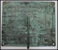 Sundial, a 19th Century ? circular bronze sundial engraved with sun motif and roman numerals  and