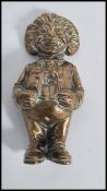 A 19th century Victorian bronze hollow figurine of a clown with open mouth.
