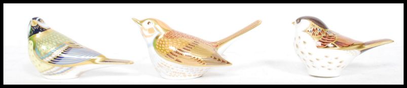 Two Royal Crown Derby paperweight modeled as birds one being a Wagtail and the other a Great tit,