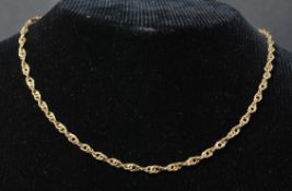 A hallmarked 9ct gold rope twist necklace chain having a lobster claw clasp. Weighs 7.2 grams.