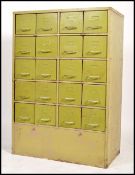 A large mid century Industrial metal 20 drawer filing cabinet. Of heavy upright pedestal form having