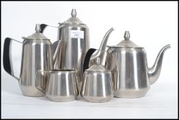 A vintage retro mid 20th century space age steel five person tea service.. Each piece having a