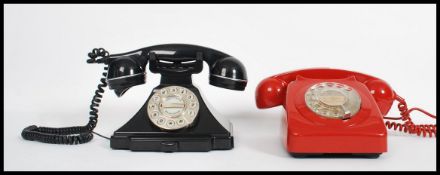 A collection of 2 vintage retro 20th century industrial ring dial telephones in red and black