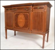 A good early 20th century French Louis XV mahogany and marquetry inlaid breakfront sideboard. Raised