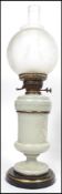 A 19th century brass and glass oil lamp having col