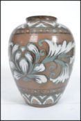 An Oriental Chinese / Japanese stoneware vase having hand painted foliage with character stamp to
