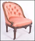 A 19th century Victorian button back bedroom armchair. Of walnut construction with fabulous reeded