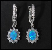 A pair of 925 silver CZ and opal drop earrings having latch backs. Marked 925.