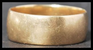 A vintage 20th century hallmarked 9ct gold band ring of simple usual form. Total weight 6.1g