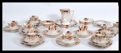 A Victorian Imari pattern extensive six person tea set consisting of six cups saucers and side