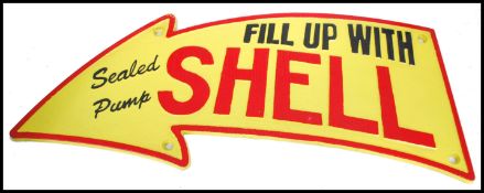 A vintage style painted cast iron advertising point of sale garage sign for Shell with notation