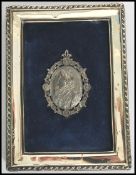 A vintage cast white metal brooch depicting the bust of Elizabeth I with inscription to the