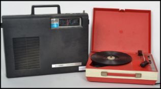 A retro 20th century Fidelity red colourway portable record player  together with a Three In One