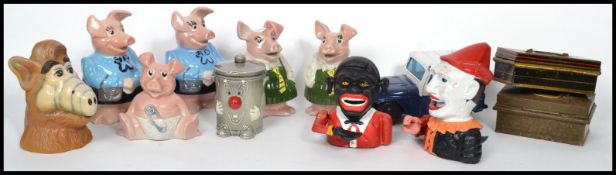 A collection of vintage 20th century money boxes to include cast metal, Dusty Bin, A.L.F, Natwest