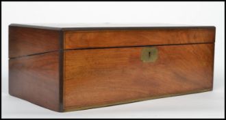 A good sized 19th century mahogany and brass inlaid writing slope opening to reveal a fully