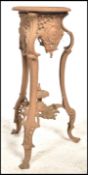 A stunning 19th century Victorian painted cast iron plant stand, fret pierces decorated with