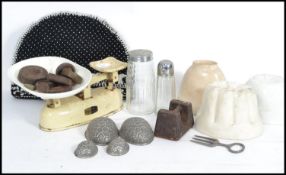 A collection of vintage 20th century kitchenalia to include a set of scales with various weights,