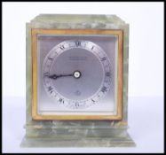 A vintage mid century retro green onyx Elliott mantel clock with silvered dial marked also for WM