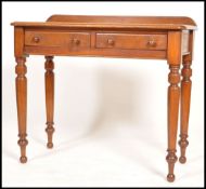 A Victorian mahogany writing table desk raised on good turned legs with ball feet, single frieze