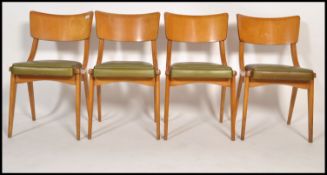 A set of 4 mid century Ben Chairs ( benchairs ) raised on angular bentwood frames with green