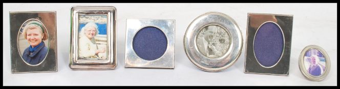 A collection of six 20th century miniature silver hallmarked easel backed glazed picture frames,