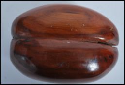 Natural History: A Coco De Mer (Lodoicea Maldivica) nut of typical form.  Measures  7cms high x 5cms