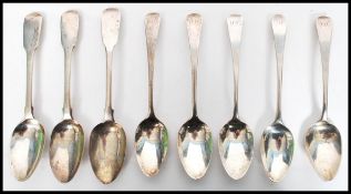A group of eight Georgian silver tea / coffee spoons to include two bearing London hallmarks for