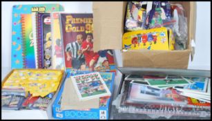 A large collection of vintage football ephemera to include a large group of sticker collecting