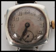 A vintage early 20th century Rolex 1917 trench military interest watch having a silvered dial Arabic