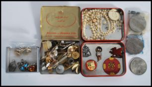 A group of vintage costume and dress jewellery to include gentleman's tie pins cuffs buttons