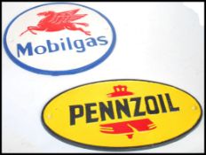 A pair of vintage style cast metal point of sale advertising garage wall plaques for Mobilgas and