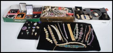 A collection of vintage silver and other costume jewellery to include a tin of various costume and