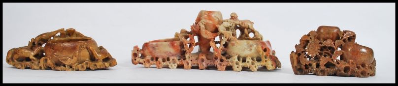 A collection of 3 vintage Chinese soapstone brush pots, each of varying design being well carved