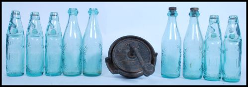 A collection of good clean coloured blue glass ( light ) lemonade bottles with the marbles intact